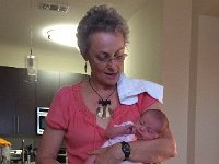 photo 2  Christine demonstrates the one-armed technique for new borns